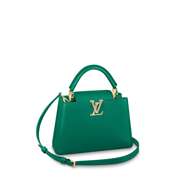 Louis Vuitton Capucines 系列手袋不只是著重於皮革設計，更是會為袋扣綴上不同材質，增加手袋的高貴感。
