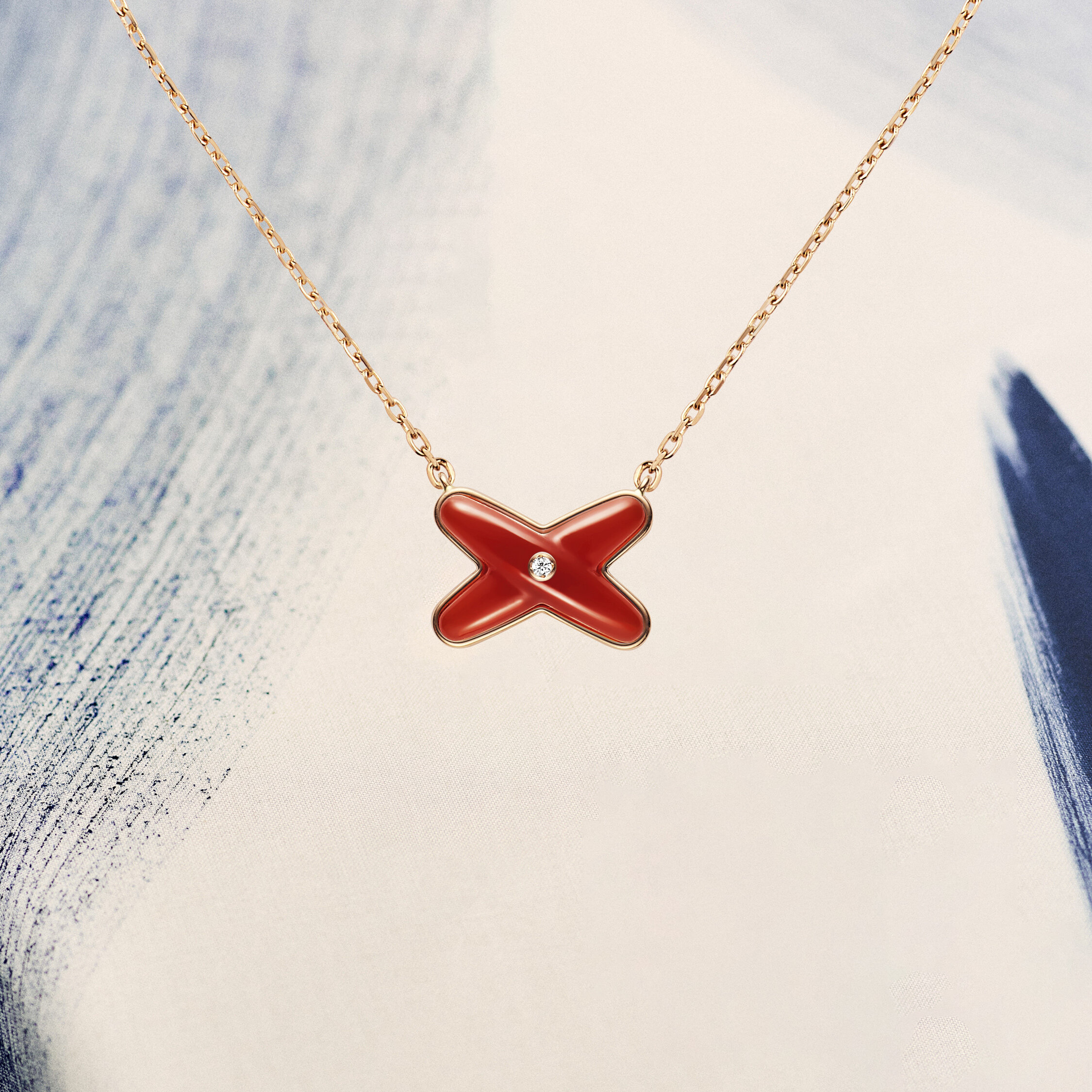 Chaumet Jeux de Liens玫瑰金吊墜，鑲嵌鑽石與紅玉髓 $12,600